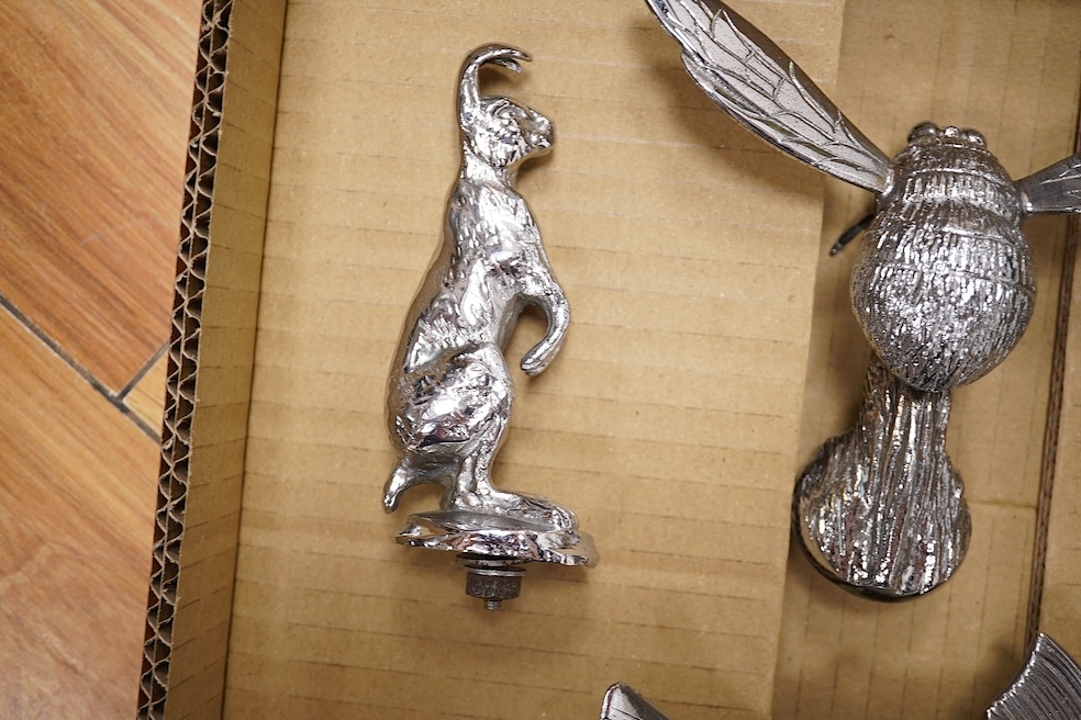 Five animal themed chrome and brass car mascots consisting of a giraffe mounted on a turned aluminium base, a hare, a bumblebee in flight, a leaping fish, and a scorpion. Condition - fair to good.